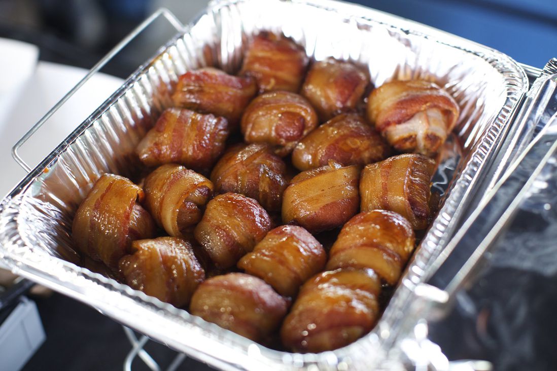 Pork tenderloins wrapped in bacon, then smoked by Walking Dog BBQ<br>